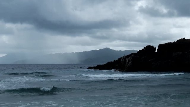 Medium waves near mountains in a gloomy day. Shot in Basco, Batanes.