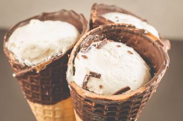 three ice cream with cone in chocolate/three ice cream with cone in chocolate, close up