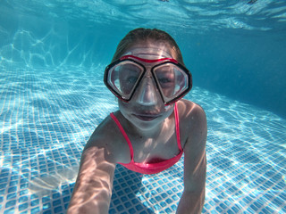 A diving girl in the swimming pool