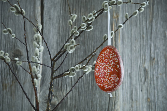 Hand-painted Easter egg hanging from Pussy Willow twigs