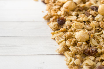 Dry Breakfast of oat flakes, granules and nuts. Muesli on a light table. Copy space