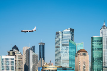 Naklejka premium modern buildings and airplane