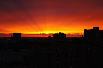 Fototapeta na wymiar Red sky on a cityscape background