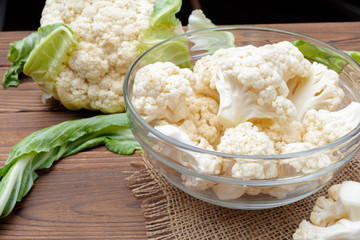 Organic cauliflower on wooden background