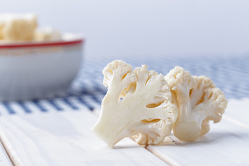 Organic cauliflower on wooden background