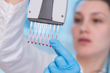 Young woman with genetic research in the laboratory research of cancer diseases
