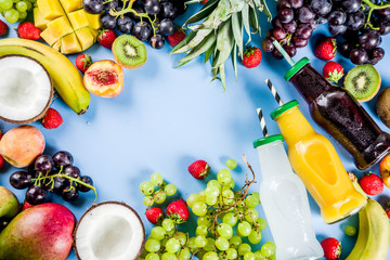 Different fruit juices smoothies concept, summer vitamins diet, with tropical fruits and berries on a light background,