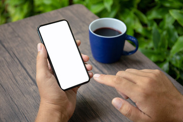 Male hands holding phone with isolated screen in cafe