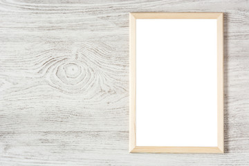 Frame mockup on white wooden table. Top view