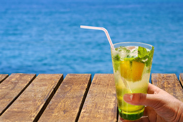 Cold mojito drink . Summer vacation concept image.