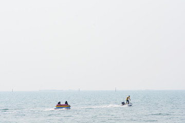 enjoy people on banana boat ride on the sea