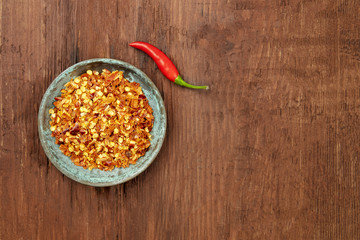 Red hot pepper, crushed and fresh chili, overhead photo with copy space