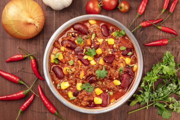 Chili con carne, traditional Mexican dish, closeup with ingredients