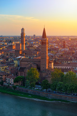 Fototapeta na wymiar Top angle view of Verona, Italy at summer sunset, sun lens flare