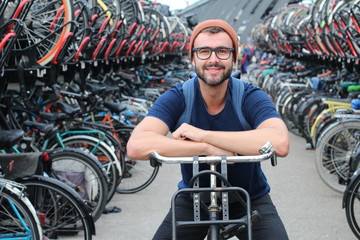 Obraz premium Man giving smiling at bicycle parking lot