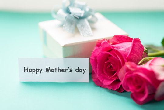 Pink roses and gift box with Happy Mother's day tag card