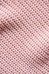full frame image of pink knitted woolen fabric background