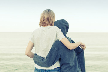 Mutual understanding between the parent and the child. Mother and daughter teenager embrace on the...