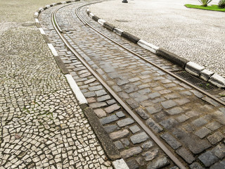 Urban tram track on stone street. City of Santos, Brazil