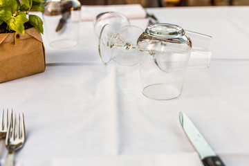 Table setting with glasses, forks and knife