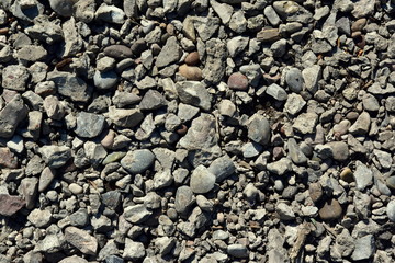Crushed, gravel, asphalt and concrete  waste are mixed. abstract background