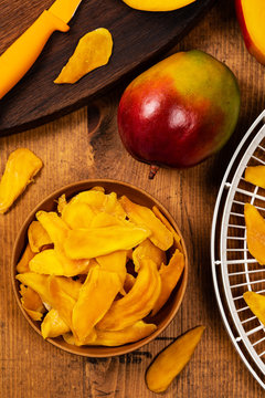 Dried Mango Fruit on Old Wooden Background. Selective focus.
