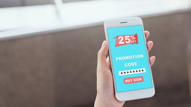 Women holding the smartphone to enter the code to get a discount from the store. The concept of providing marketing services on the internet for easy access to information.