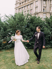 Full-length view of the walk of newlyweds in the garden.