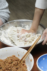 Hand Mixing Flour In Steel Bowl