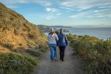 Family walking along coastal trail