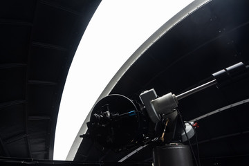 Naklejka premium The telescope inside the observatory, dome opens, isolated.jpg