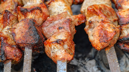 delicious juicy meat with spices cooked on the charcoal grill.