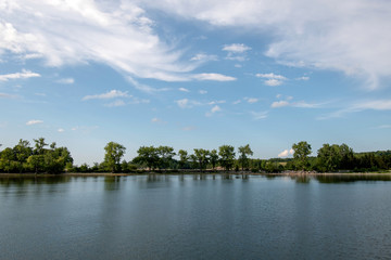 Fototapeta na wymiar Lake Champlain with blue sky and clouds 