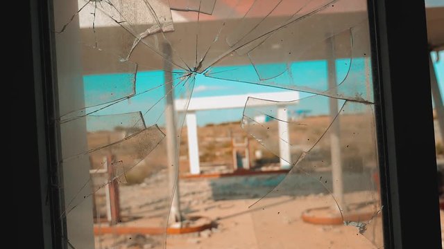 Route 66. crisis road 66 fueling broken window slow motion video. Old dirty deserted gas station. U.S. closed supermarket store shop Abandoned gas station oil end lifestyle of fuel the world