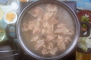 Chef scald beef with hot water  for cooking