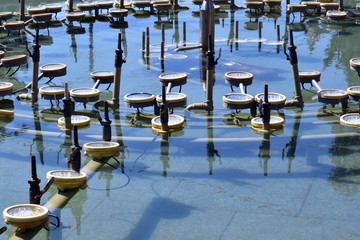 Fountain nozzle in the water, close-up view