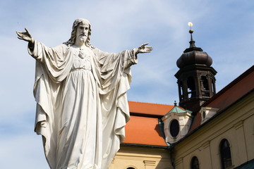 Jesus Christ with open arms statue in front of Pilgrimage Basilica of the Assumption of the Virgin Mary and St. Cyril and Methodius at Velehrad Monastery, Moravia, Czech Republic