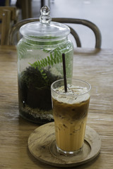 Glass of iced milk tea and espresso