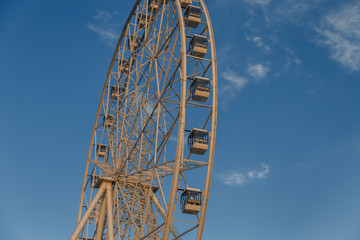 Very large Ferris wheel against the blue sky.
