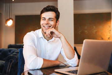 Portrait of a happy young formal dressed man