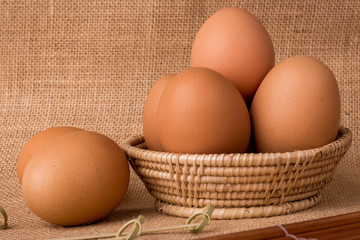 Set Eggs in a basket on  gunny (sackcloth)  background