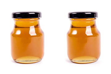 Honey bottle isolated on white background