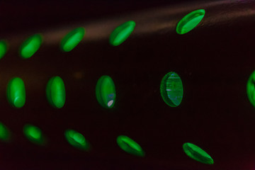 Bright colored lamps on carousels at night.