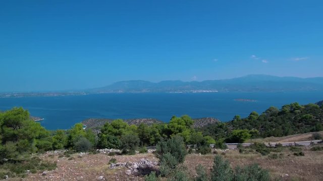 Aerial footage of a mountain in Argolis Greece. View of the Saronic gulf. Reveal shot.