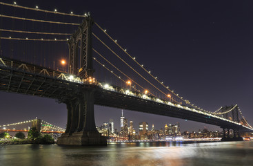 Fototapeta na wymiar Manhattan and Brooklyn bridges with New York City skyline at night, USA