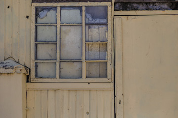 Naklejka na ściany i meble old dirty window on old dirty wall.