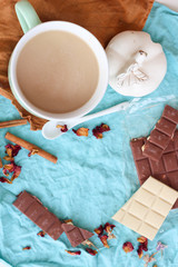 Chocolate, rose,coffee and cinnamon. Layout on a blue background. Plate 