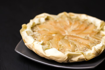 Apple cake with almond cream on a dark background. Baked cake. Casserole Cooked in multivarts Proper nutrition. Pie for the whole family on a sunny day