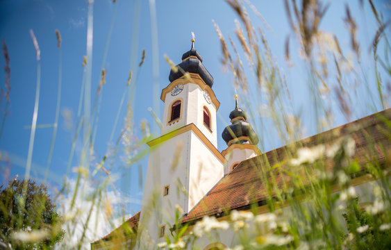 Church in Aschau im Chiemgau at lake Chiemsee on a beautiful summer day with green nature