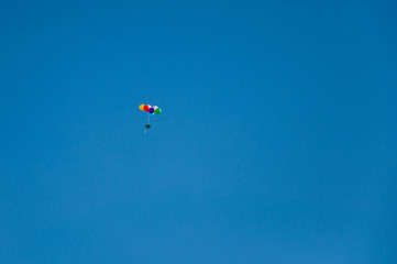 Background colorful balloons flying in the blue sky
